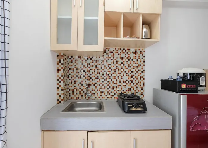Homey And Comfort Living Studio Room At Bassura City Apartment By Travelio